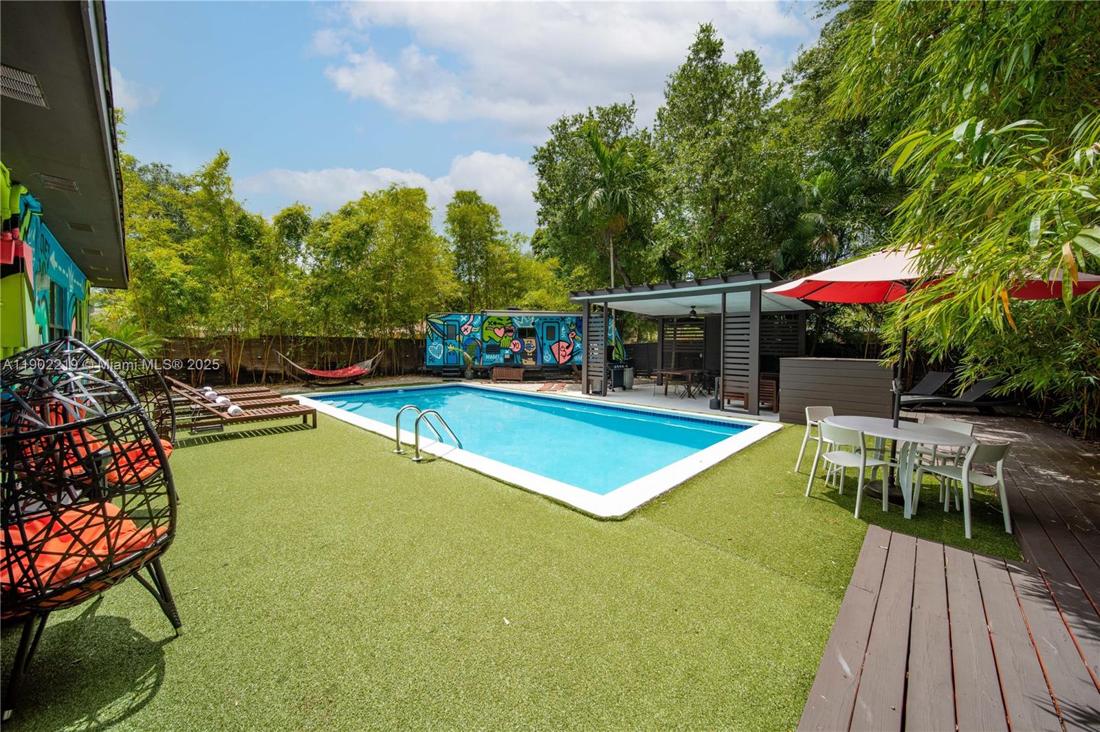 710 Northeast 141st Street North Miami, FL 33161 - Photo 34 of 78 an outdoor space with swimming pool having patio