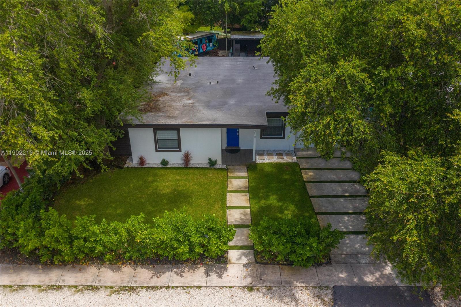 710 Northeast 141st Street North Miami, FL 33161 - Photo 42 of 78 a front view of house with a garden