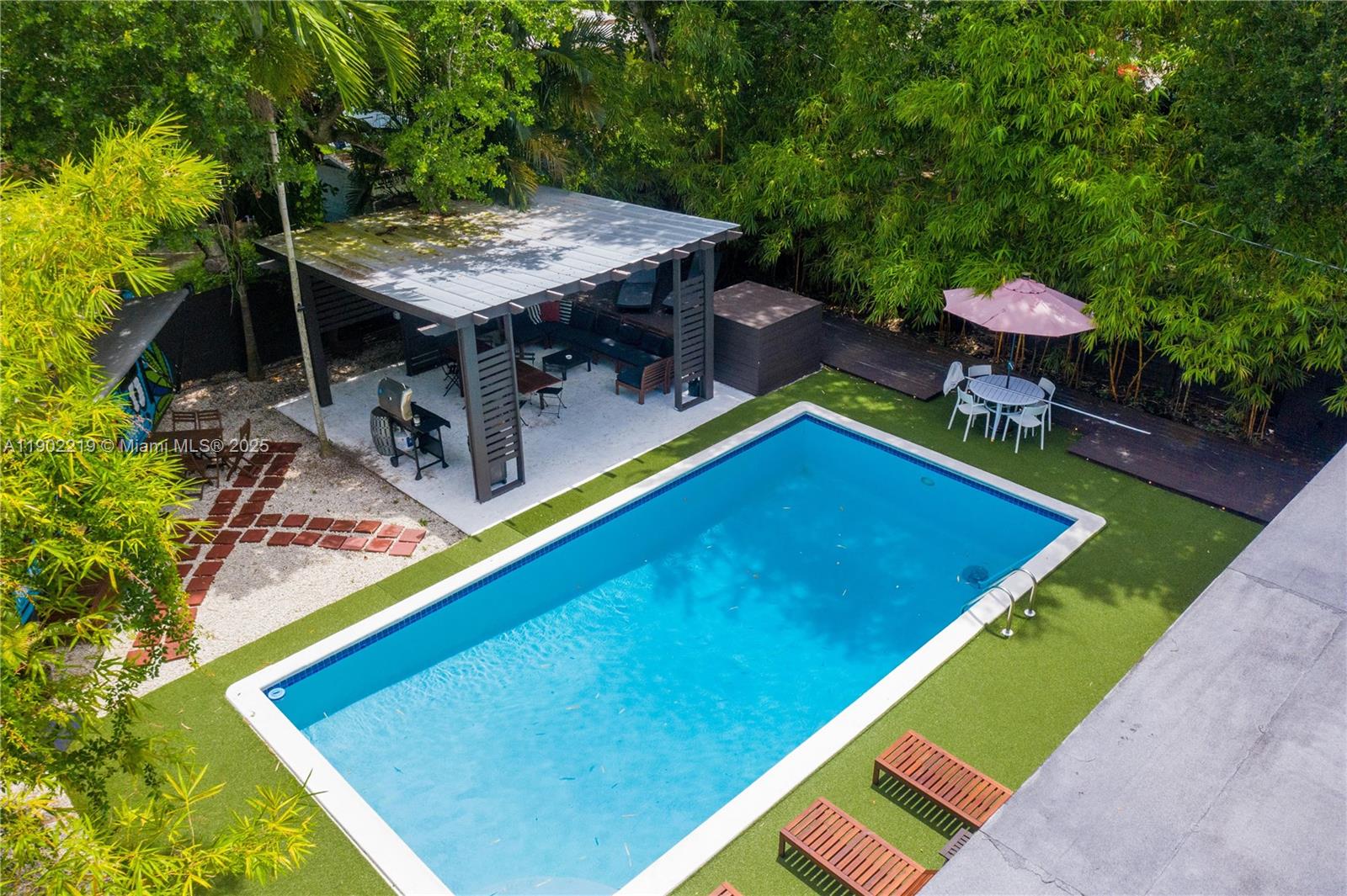 710 Northeast 141st Street North Miami, FL 33161 - Photo 46 of 78 a view of a backyard with a patio and outdoor seating