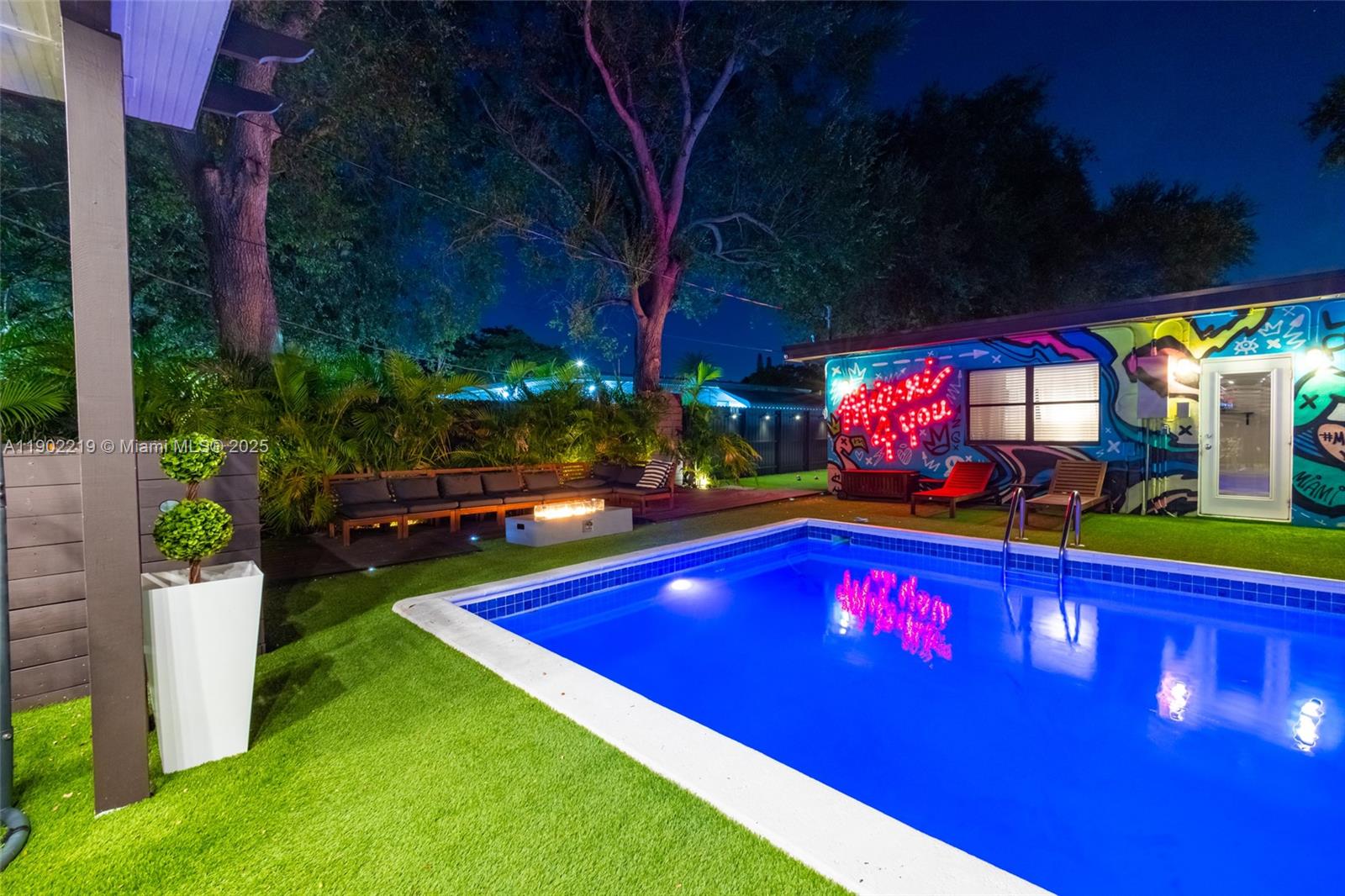 710 Northeast 141st Street North Miami, FL 33161 - Photo 66 of 78 a view of swimming pool a patio and fire pit