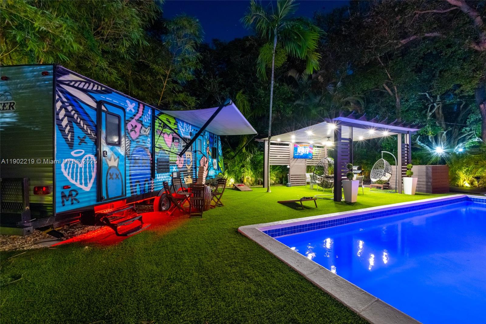 710 Northeast 141st Street North Miami, FL 33161 - Photo 69 of 78 a view of a play ground in front of a house with a yard