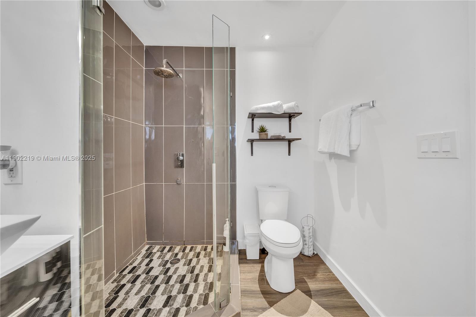 710 Northeast 141st Street North Miami, FL 33161 - Photo 10 of 78 a bathroom with a toilet and a shower