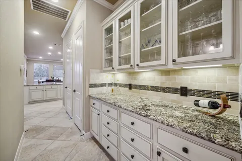 a kitchen with stainless steel appliances granite countertop a sink and cabinets
