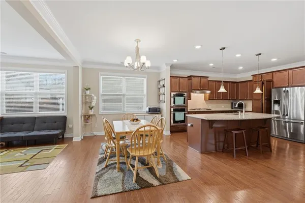 a view of a dining room with furniture window and outside view