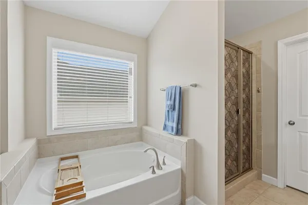 a white bath tub sitting next to a window