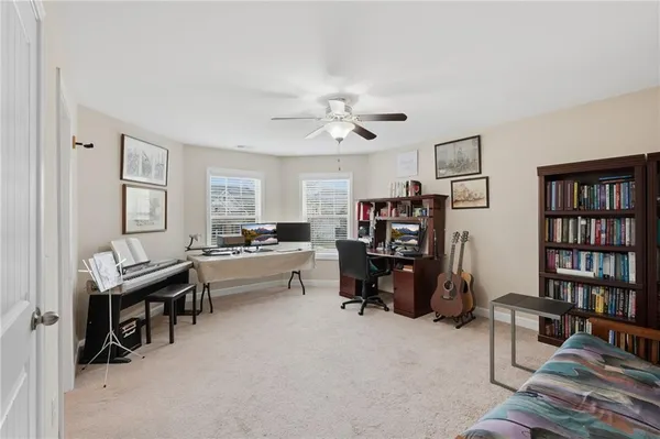 a view of a workspace with furniture and toys