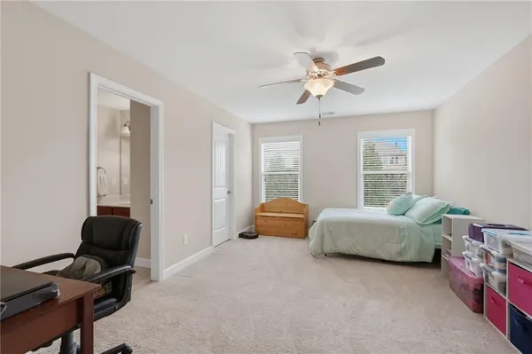 a bedroom with furniture and a window
