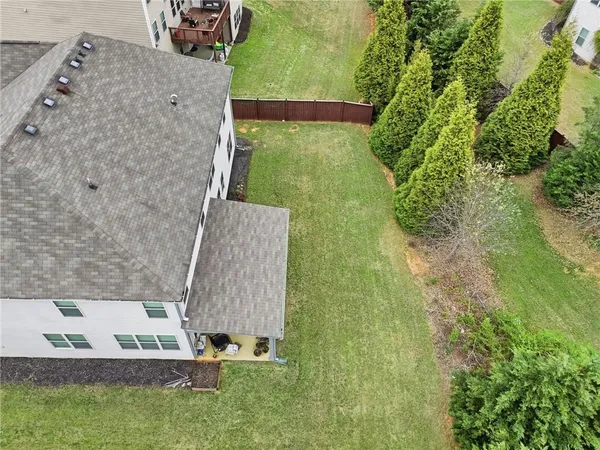 swimming pool view with a garden