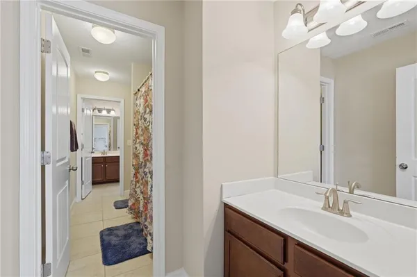 a en suite bathroom with a sink and a mirror