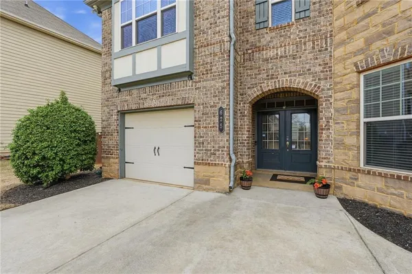an entrance to house with yard