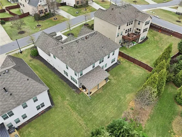 a view of a backyard with chairs