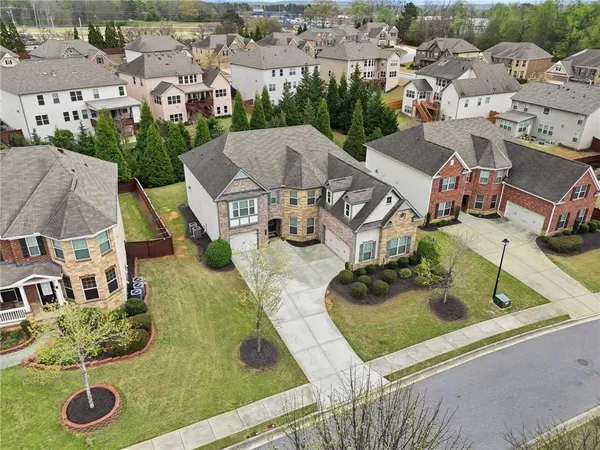 an aerial view of multiple houses with yard