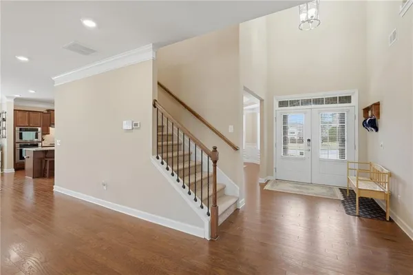 a view of an entryway with wooden floor