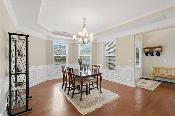 a view of a dining room with furniture window and wooden floor