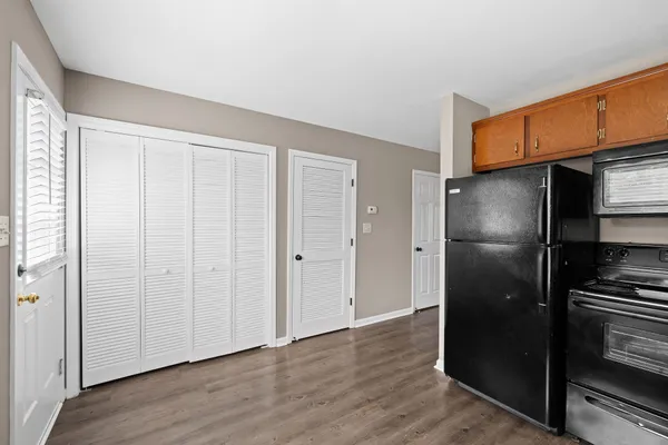 a kitchen with stainless steel appliances granite countertop a refrigerator and a stove top oven