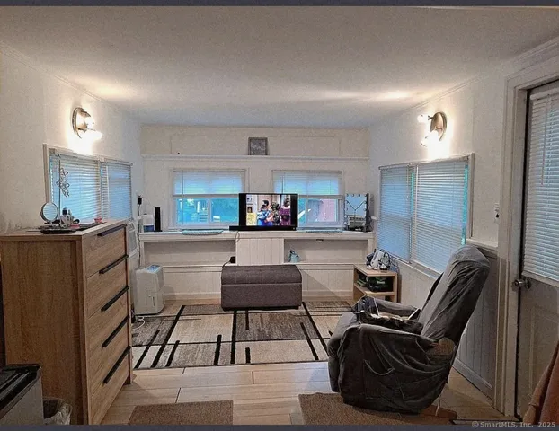 a kitchen with stainless steel appliances kitchen island granite countertop a sink stove and cabinets