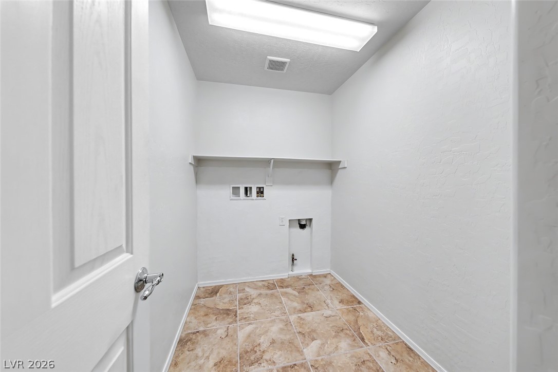 2356 Rue Bienville Way Henderson, NV 89044 - Photo 17 of 20 This dedicated laundry room provides convenience and functionality for everyday tasks.