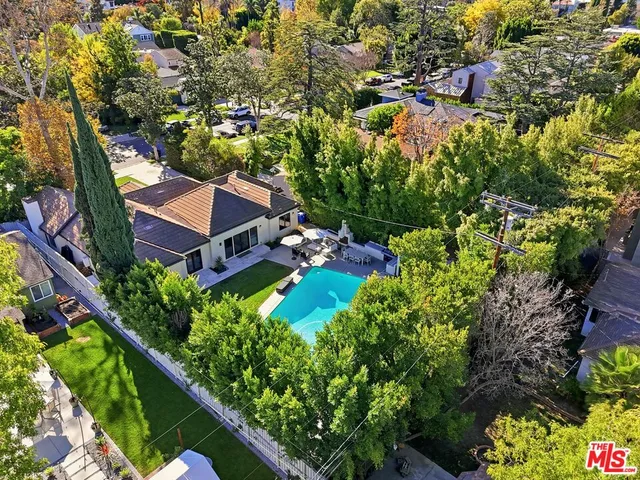 a view of a house with a yard and garden
