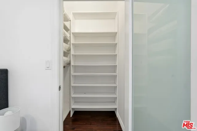 a storage room with a wooden floor