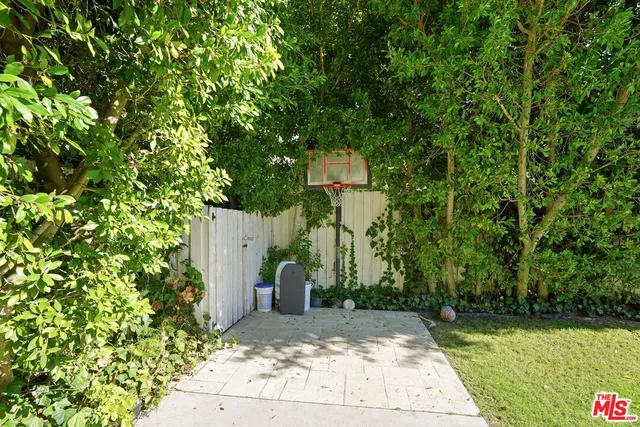 a view of a pathway of a house along with trees
