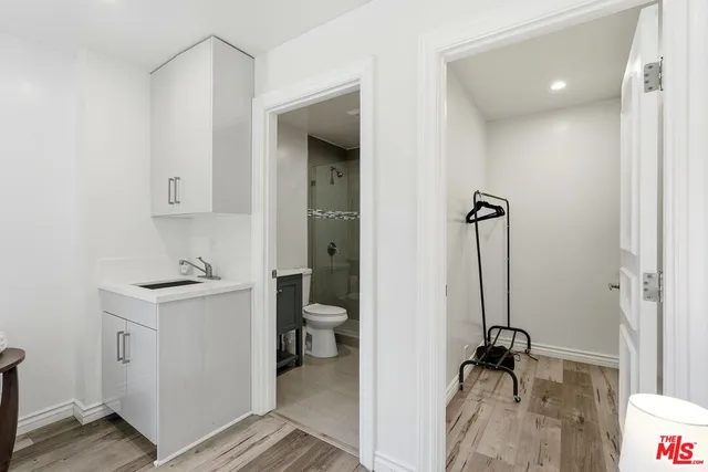 a view of a bathroom with a sink and mirror
