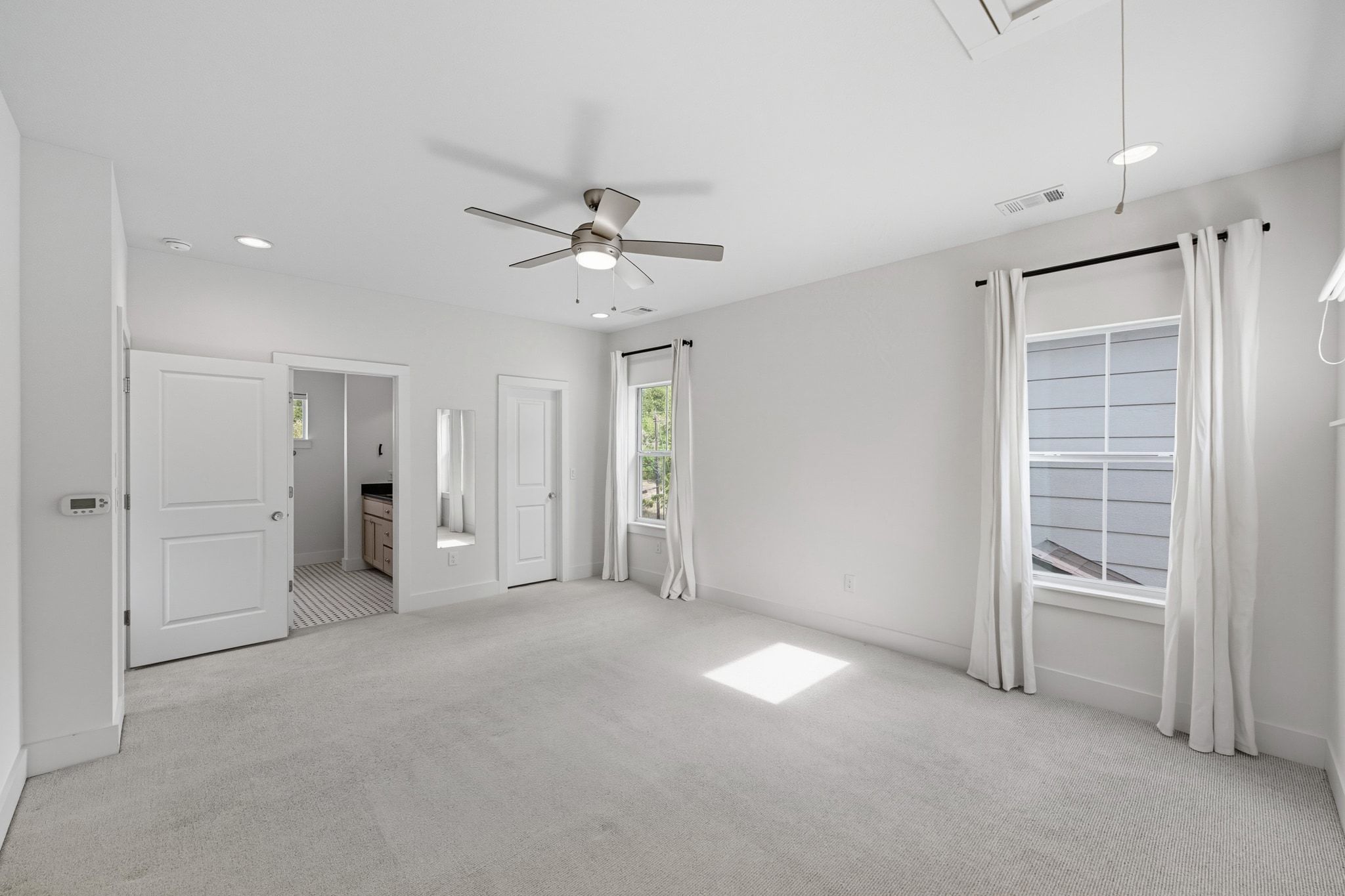 1010 Muse Lane, Unit 15 Austin, TX 78702 - Photo 11 of 22 an empty room with closet and windows