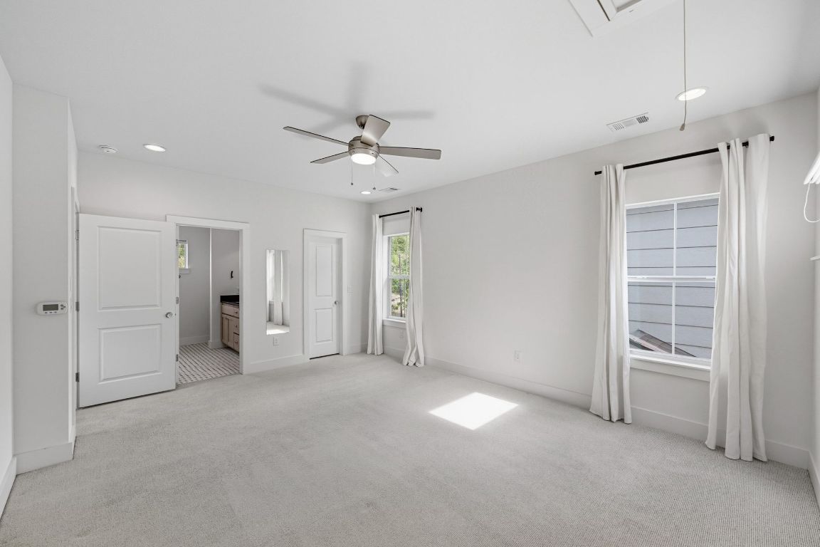 1010 Muse Lane, Unit 15 Austin, TX 78702 - Photo 11 of 22 an empty room with closet and windows