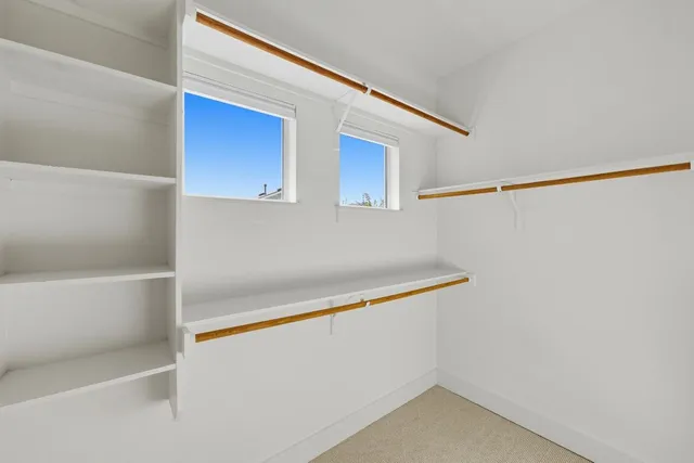 a view of an empty walk in closet