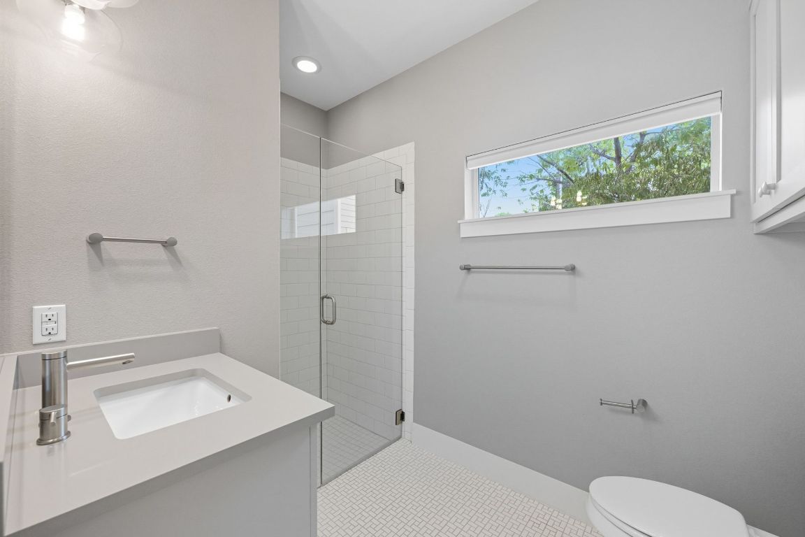 1010 Muse Lane, Unit 15 Austin, TX 78702 - Photo 17 of 22 a bathroom with a sink toilet and window