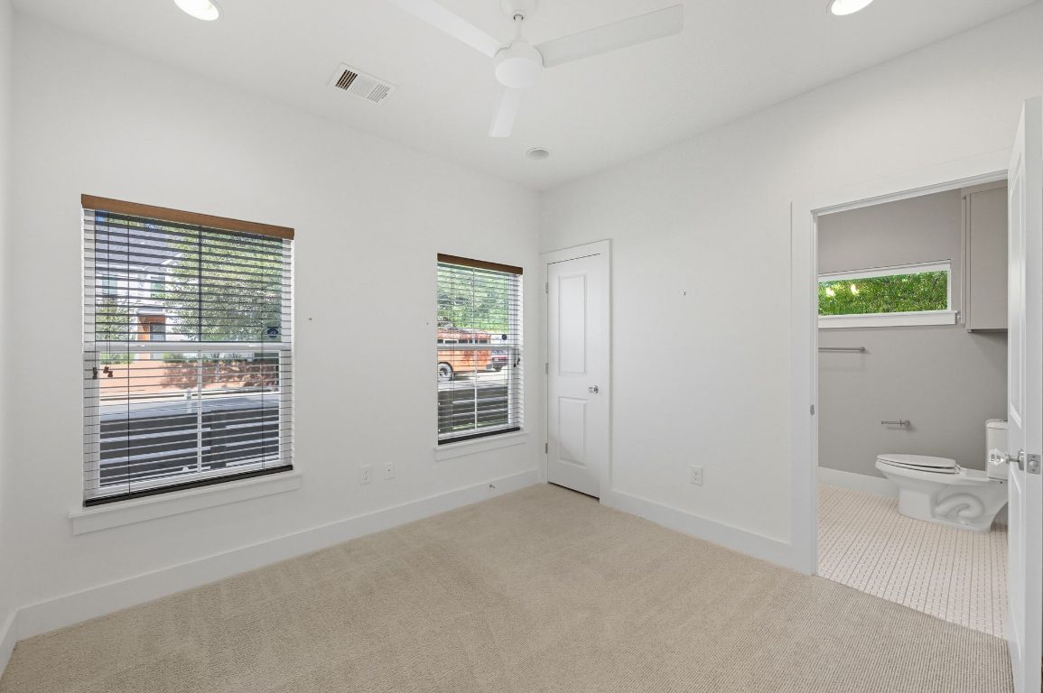 1010 Muse Lane, Unit 15 Austin, TX 78702 - Photo 18 of 22 a view of an empty room with a window and bathroom