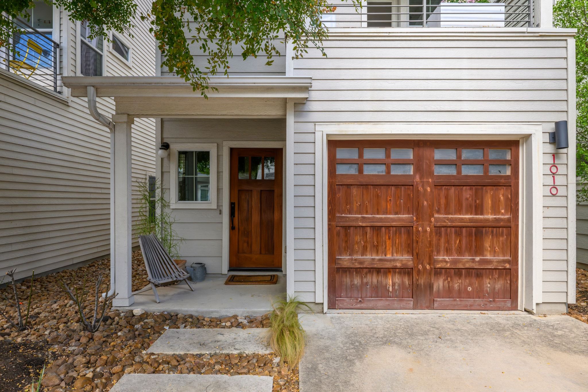 1010 Muse Lane, Unit 15 Austin, TX 78702 - Photo 2 of 22 a view of a house with a door and a large tree