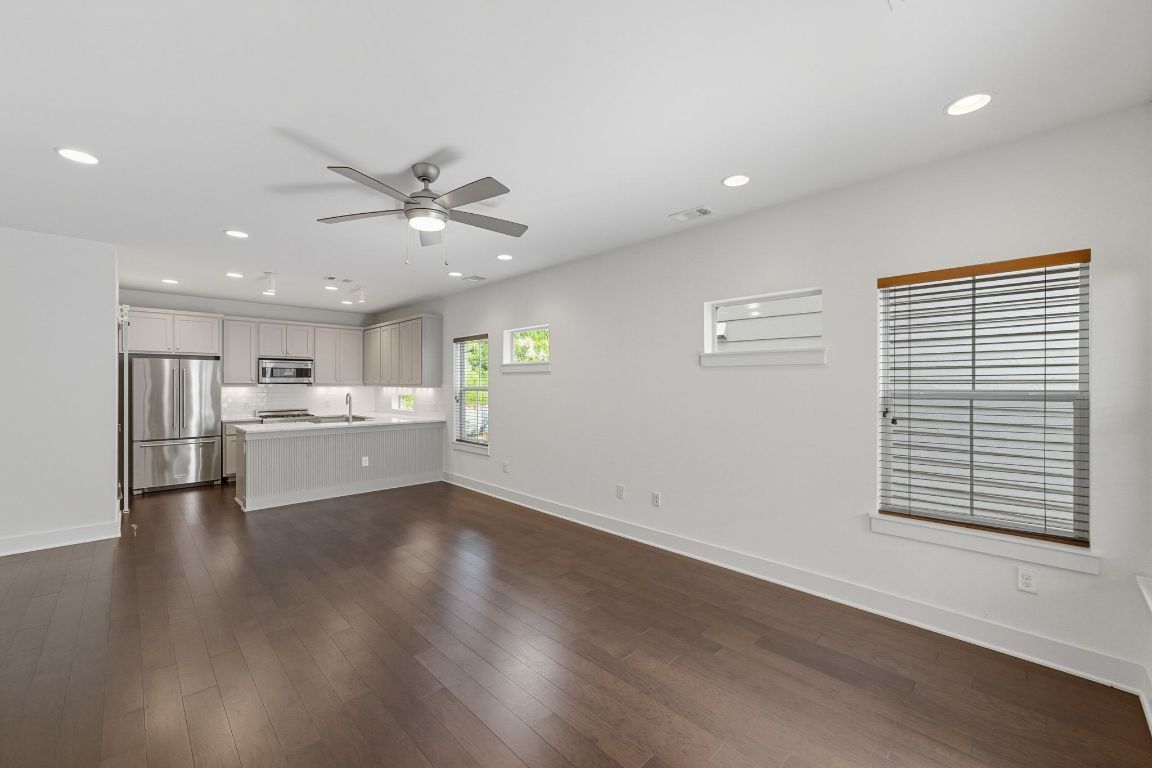1010 Muse Lane, Unit 15 Austin, TX 78702 - Photo 22 of 22 a view of an empty room with a kitchen and a window