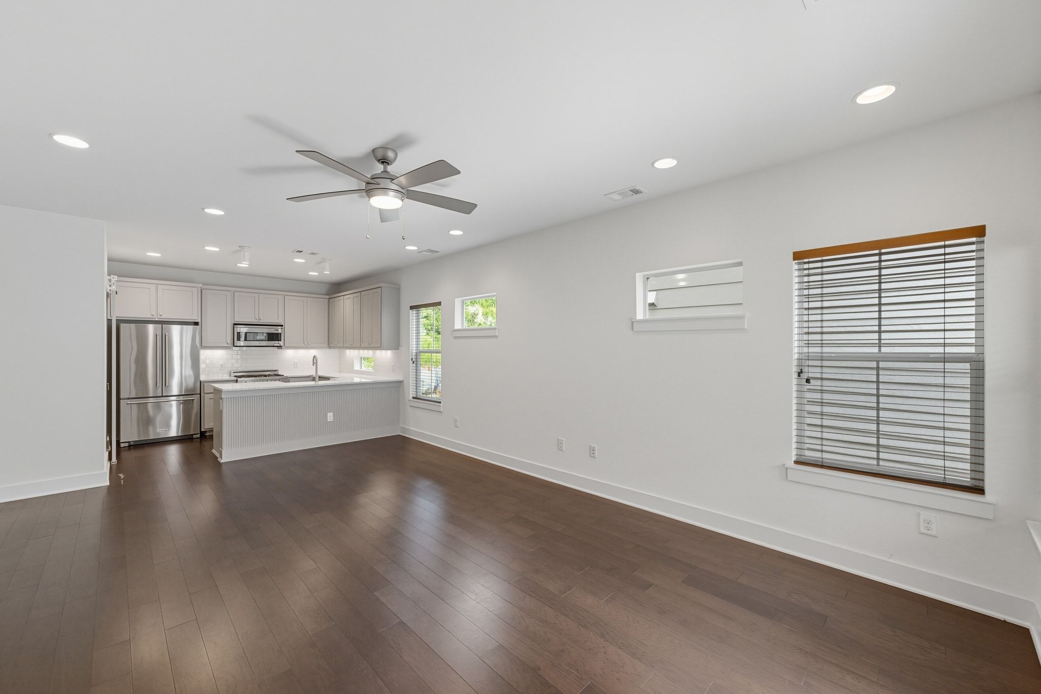 1010 Muse Lane, Unit 15 Austin, TX 78702 - Photo 22 of 22 a view of an empty room with a kitchen and a window