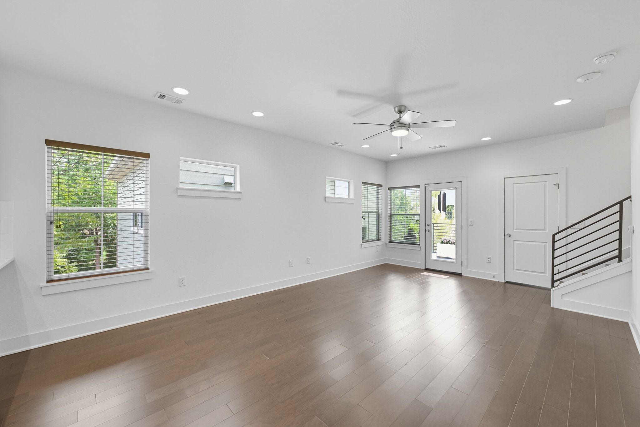1010 Muse Lane, Unit 15 Austin, TX 78702 - Photo 3 of 22 a view of an empty room with wooden floor and a window