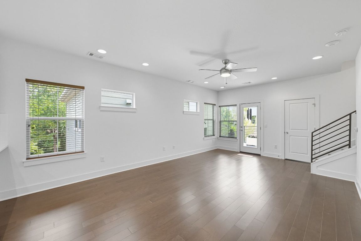 1010 Muse Lane, Unit 15 Austin, TX 78702 - Photo 3 of 22 a view of an empty room with wooden floor and a window
