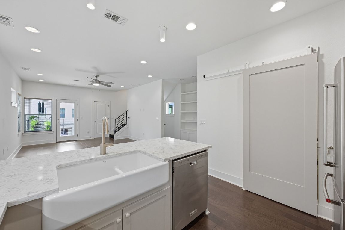 1010 Muse Lane, Unit 15 Austin, TX 78702 - Photo 9 of 22 a view of a sink and a refrigerator in a room
