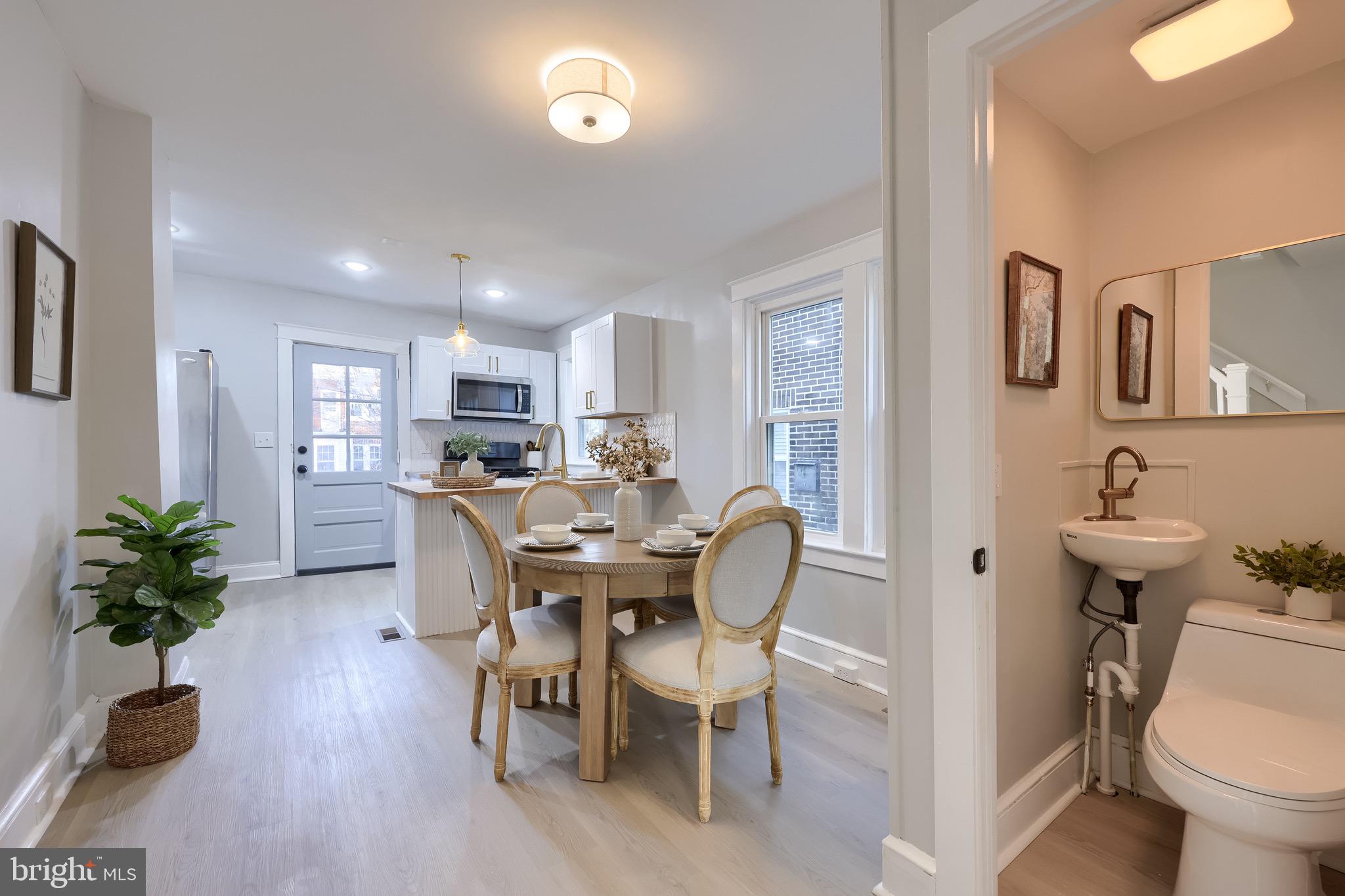 839 George Street Lancaster, PA 17603 - Photo 7 of 20 a view of a dining room with furniture and a potted plant