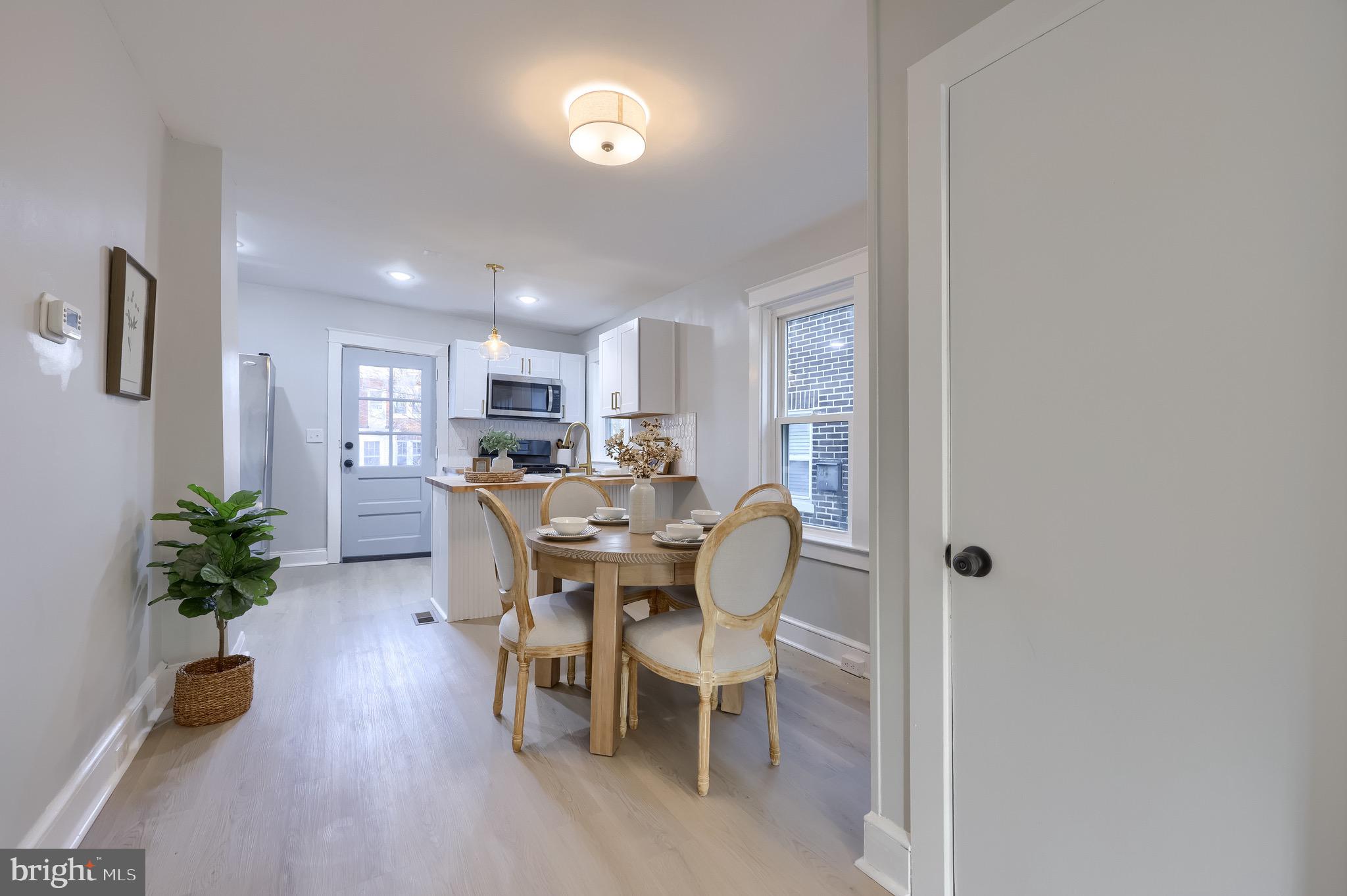 839 George Street Lancaster, PA 17603 - Photo 9 of 20 a view of a dining room with furniture and a potted plant