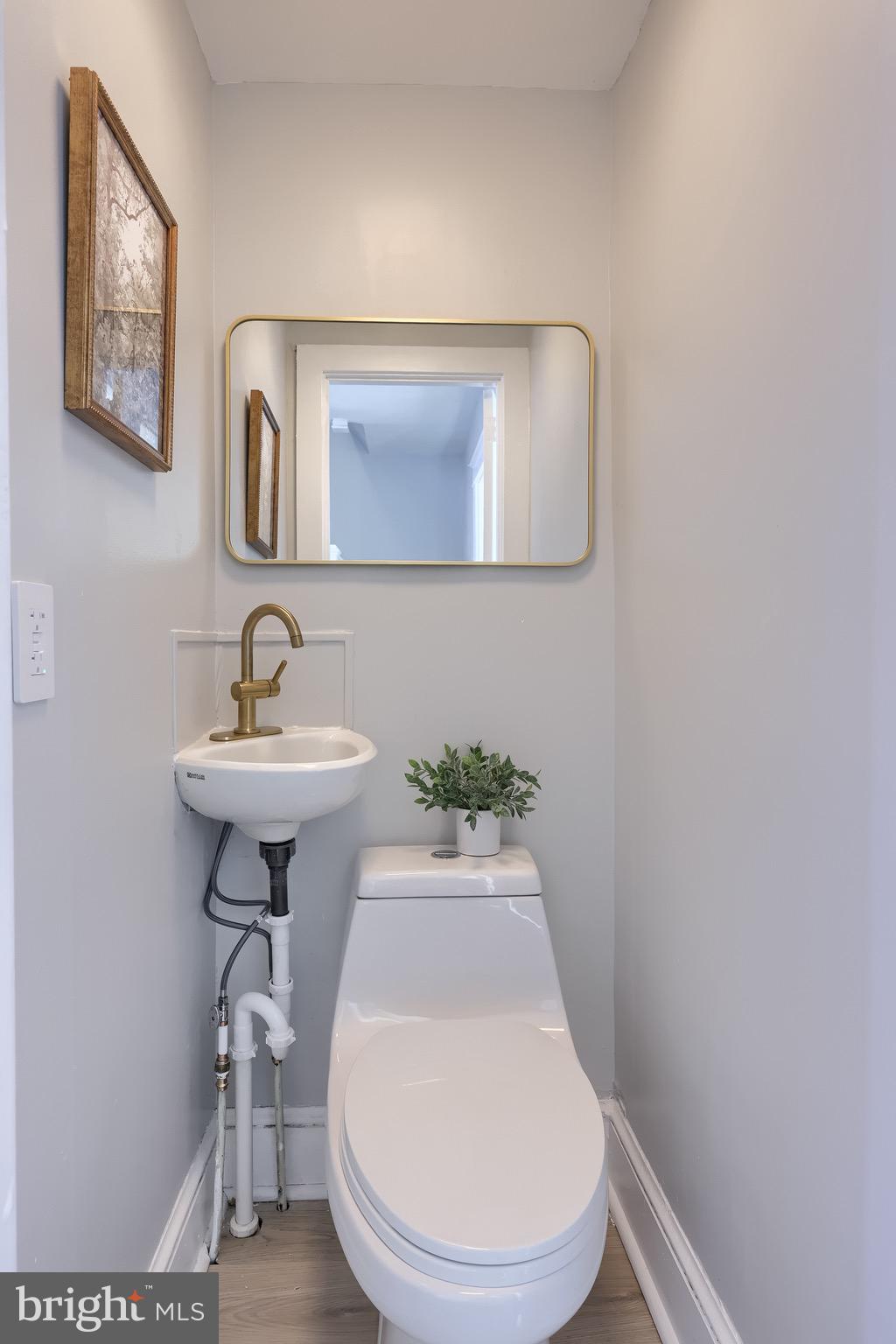 839 George Street Lancaster, PA 17603 - Photo 10 of 20 a bathroom with a sink mirror and toilet