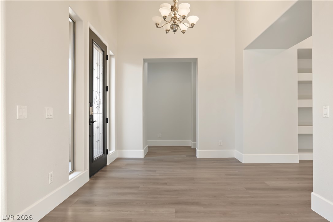 6 Mohansic Road Henderson, NV 89052 - Photo 15 of 38 A soaring ceiling and clean-lined wood flooring set an elegant tone in the entry foyer.