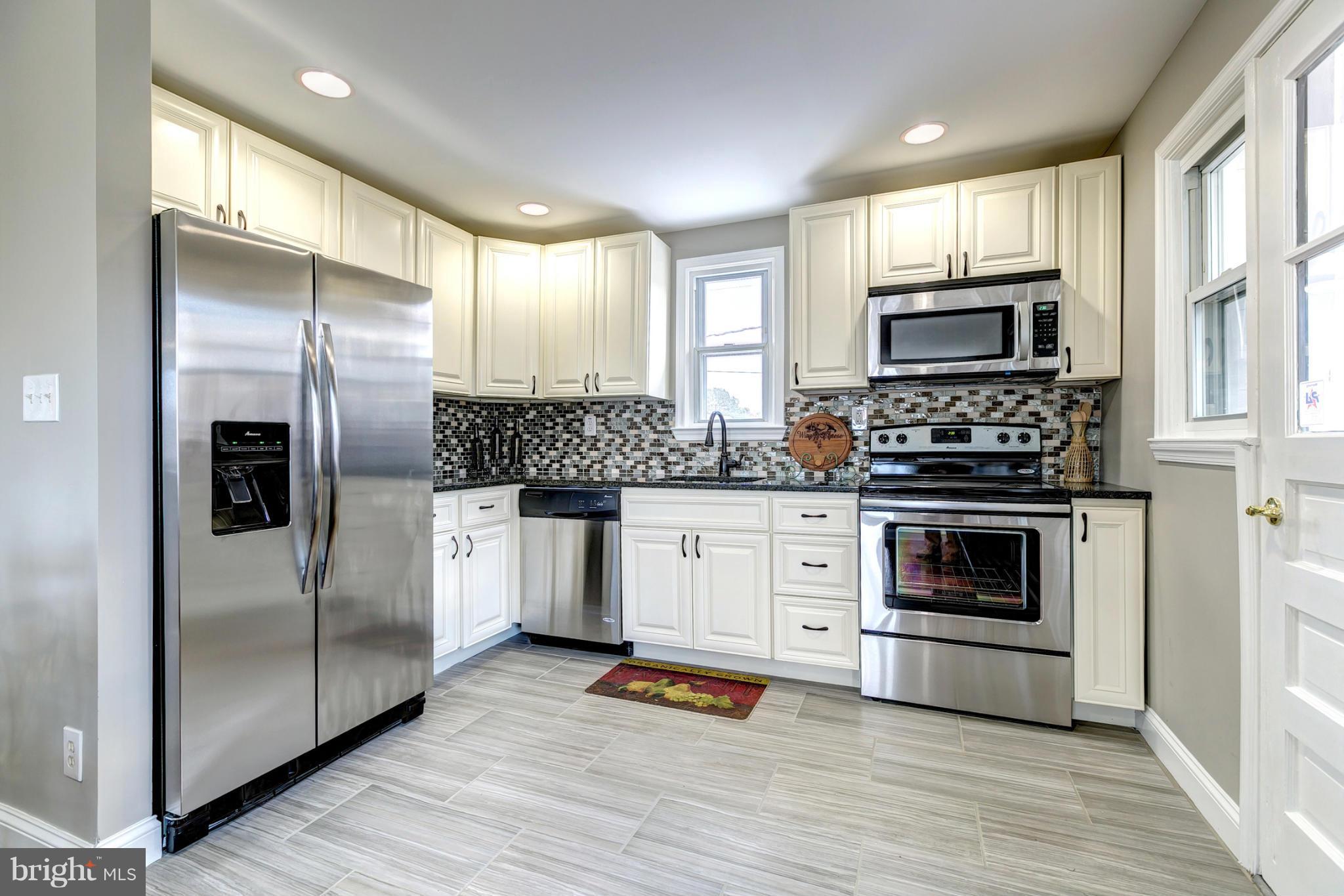 1825 Weyburn Road Baltimore, MD 21237 - Photo 10 of 30 Granite Kitchen With Stainless Steel Appliances