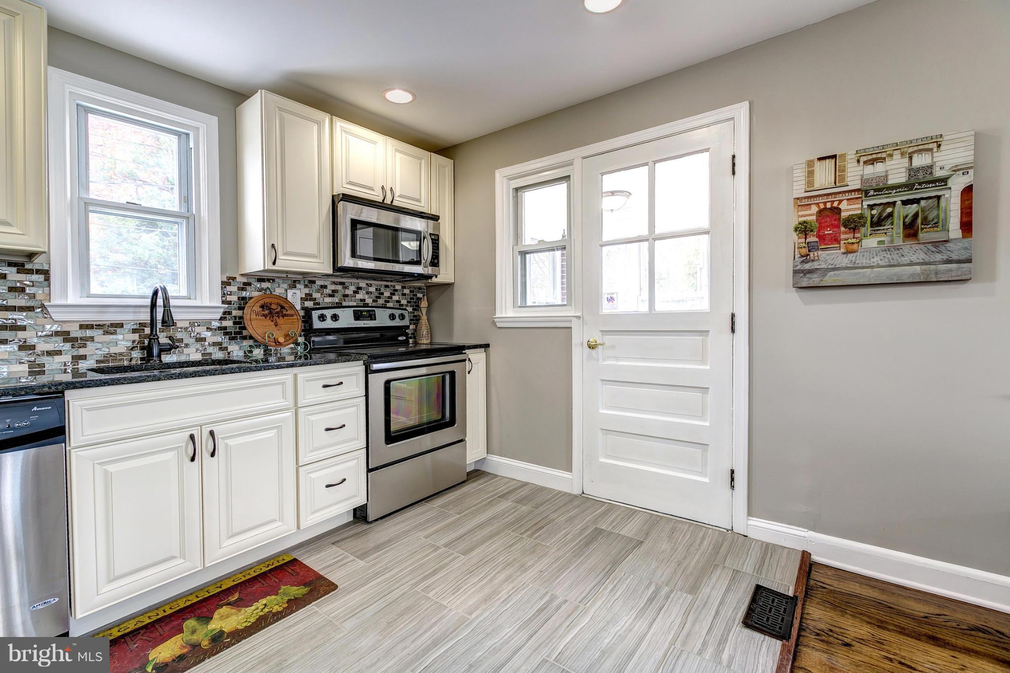1825 Weyburn Road Baltimore, MD 21237 - Photo 11 of 30 Kitchen With Custom Tile Back Splash