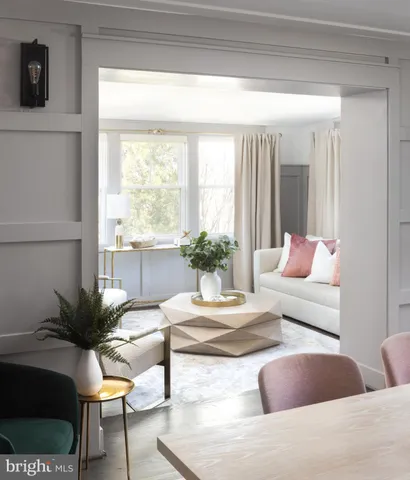 a bedroom with a bed and a lamp on dresser