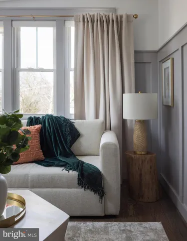 a bathroom with a granite countertop sink a mirror and shower