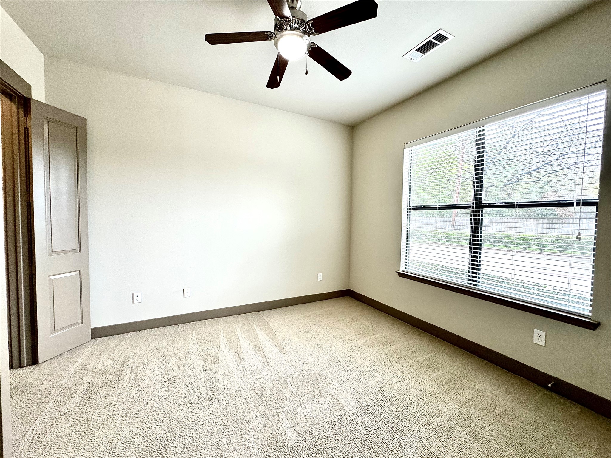 2033 South Gessner Road, Unit 2108 Houston, TX 77063 - Photo 10 of 21 a view of an empty room with a window