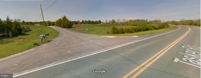 a view of a swimming pool and a yard