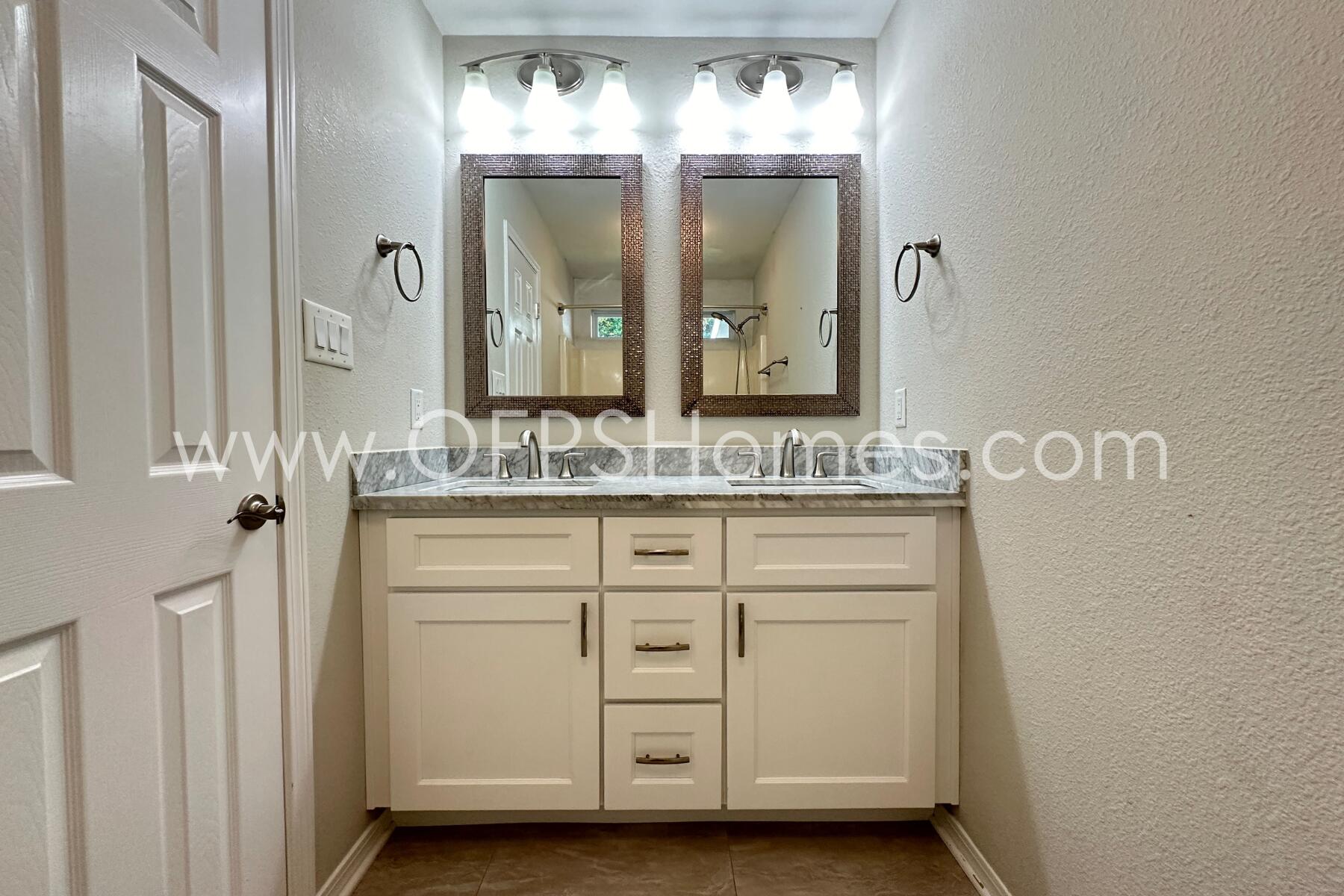 932 Emily Circle Fort Walton Beach, FL 32547 - Photo 17 of 20 a bathroom with a sink and a mirror