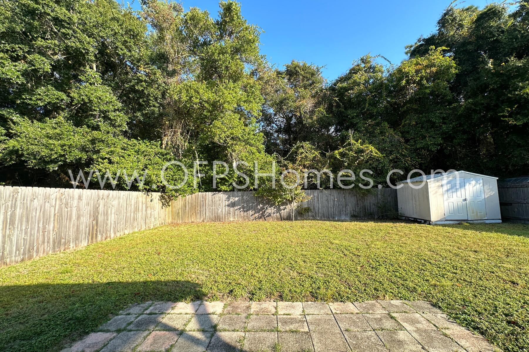 932 Emily Circle Fort Walton Beach, FL 32547 - Photo 20 of 20 a view of swimming pool with a yard