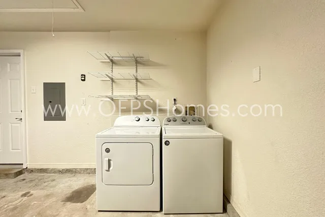 a utility room with dryer and washer