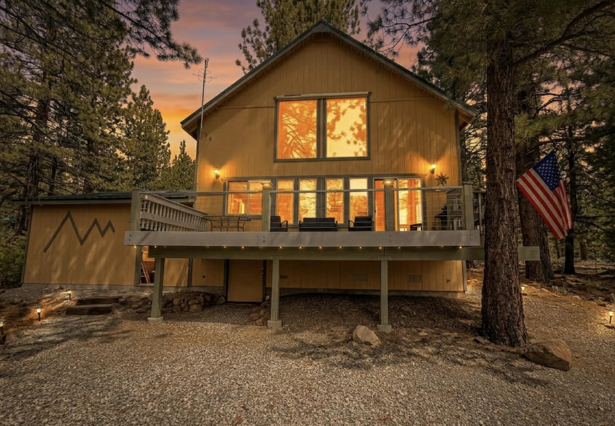 a view of a house with a window and sitting area